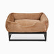 Light brown faux fur elevated dog bed by Fuzi, designed for enhanced airflow, support, and comfort, in light brown plush with a black metal base.