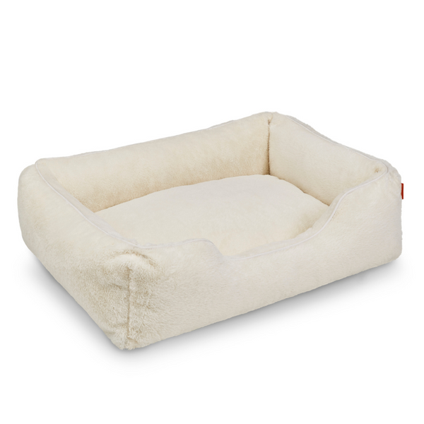 The Sammy bolster dog bed in white faux fur by Fuzi, washable dog bed, available in four beautiful colors and three sizes.