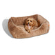 Small size Sammy bolster dog bed by Fuzi with a washable, removable cover in light brown fur