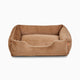 Sammy bolster dog bed in a medium light brown faux fur by Fuzi, with a removable cover available in four beautiful colors and three sizes.