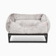 Light grey faux fur elevated dog beds by Fuzi, designed for enhanced airflow, support, and comfort, in light grey fur with a black metal base.