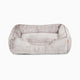 Sammy bolster dog bed in medium light grey faux fur by Fuzi, with a removable cover available in four beautiful colors and three sizes.