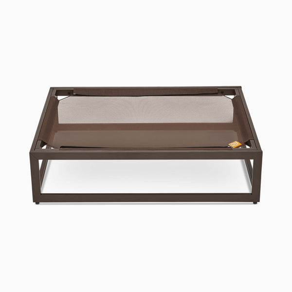 The elevated Up Pup platform dog bed by Fuzi, featuring a metal frame in brown, perfect for adding the Sammy bolster dog bed on top, available in small, medium, and large, offering orthopedic support and suitable for outdoor use