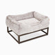 Light grey faux fur raised dog beds by Fuzi, designed for enhanced airflow, support, and comfort, in light grey fur with a black metal base.