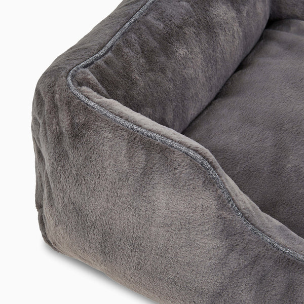 Swatch of dark grey faux fur elevated dog beds by Fuzi, designed for enhanced airflow, support, and comfort.