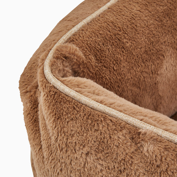 Swatch of light brown faux fur for elevated dog bed by Fuzi, designed for enhanced airflow, support, and comfort, in light brown plush.