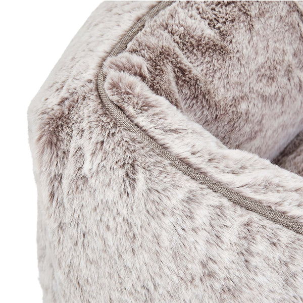 Swatch of Light grey faux fur elevated dog beds by Fuzi, designed for enhanced airflow, support, and comfort, in light grey fur with a black metal base.