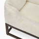 Swatch of the fuzi elevated dog bed in white faux fur, raised luxury dog beds by Fuzi, designed for enhanced airflow, support, and comfort, in white plush with a brown metal base.