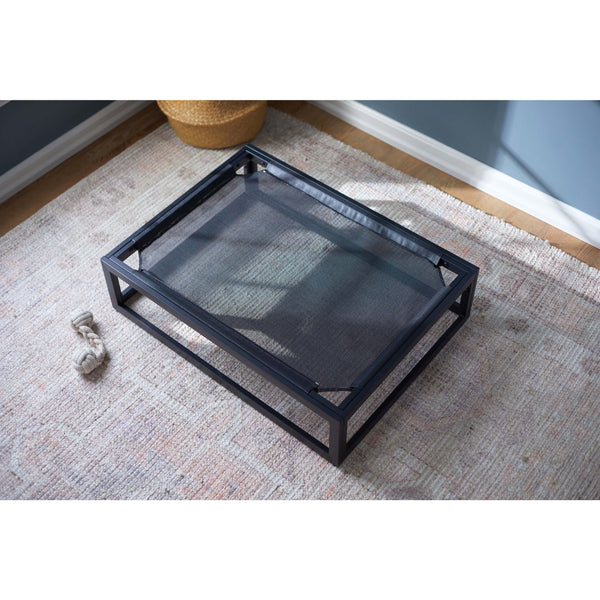 Indoor use of the Up Pup platform dog bed by Fuzi, featuring a metal frame in black, perfect for adding the Sammy bolster dog bed on top, available in small, medium, and large, offering orthopedic support and suitable for outdoor use